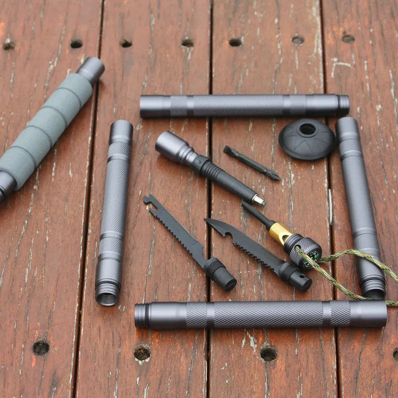 Dark grey aluminium alloy trekking pole with tactical knife and multi-tool accessories, adjustable from 106cm to 125cm