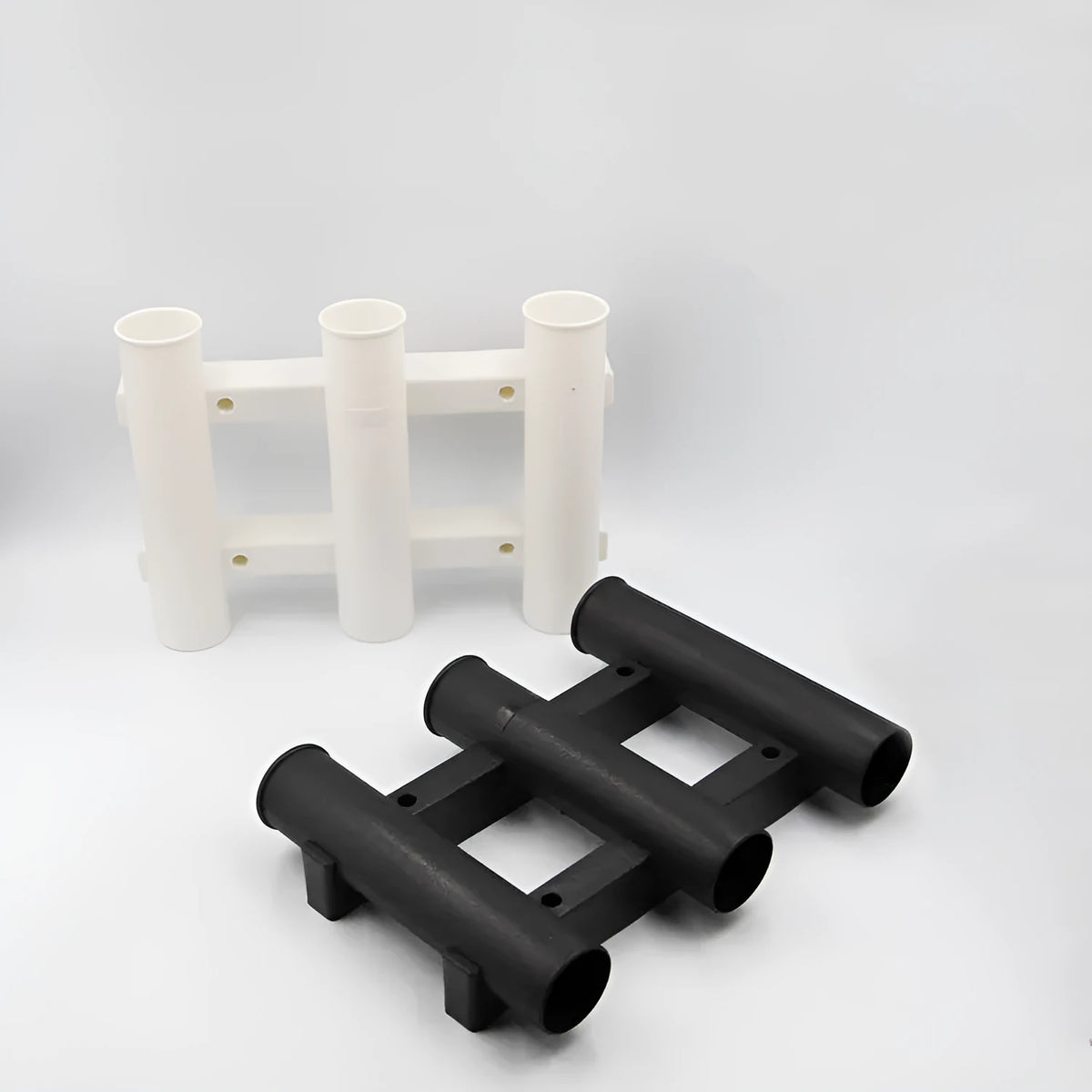 Black or white 3-hole sea fishing rod turret in ABS plastic, 31.5cm x 22.6cm x 6.5cm, with 5cm rod holes.