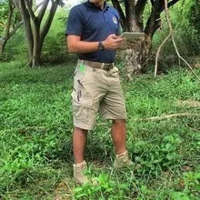 Tactical pants in black with waterproof windproof fabric and multiple pockets for outdoor use
