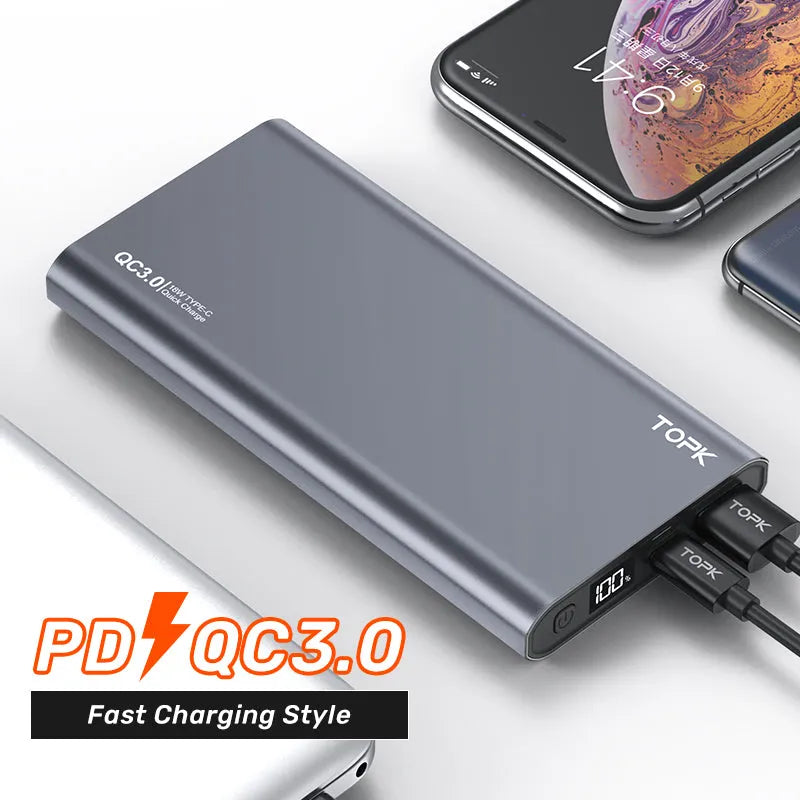 Silver 10,000 mAh fast charging power bank with digital display and metal shell on white background