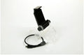 Black PS4 controller clip holding an Android phone, with a micro USB OTG cable connected