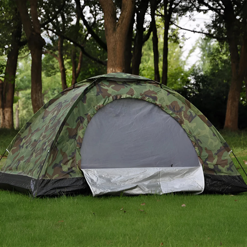 Green camouflage two-person tent with mesh windows, pitched outdoors.