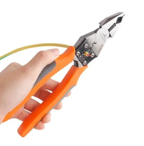 Orange handled multi-function wire cutter pliers with chrome steel head on a workbench.