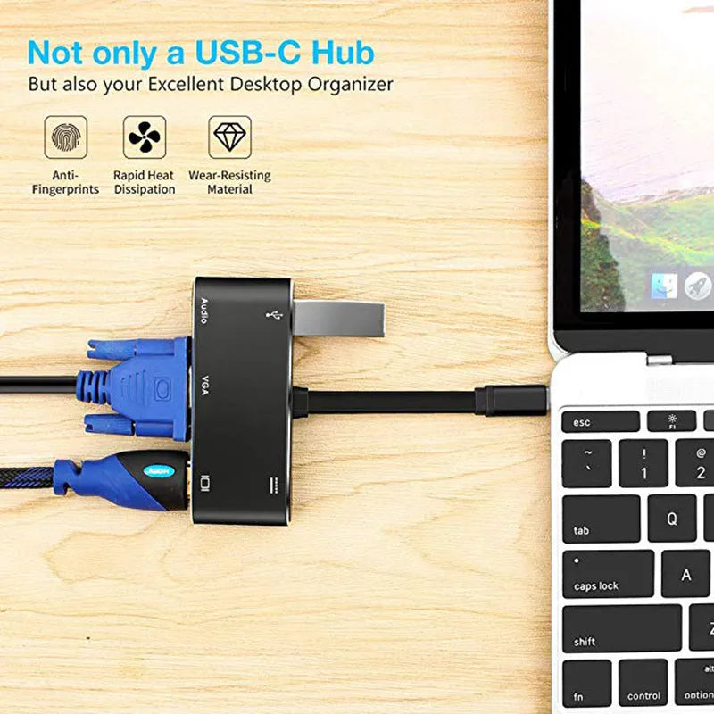 Black aluminium alloy 5-in-1 Type-C to HDMI and VGA adapter with USB and PD ports on a desk