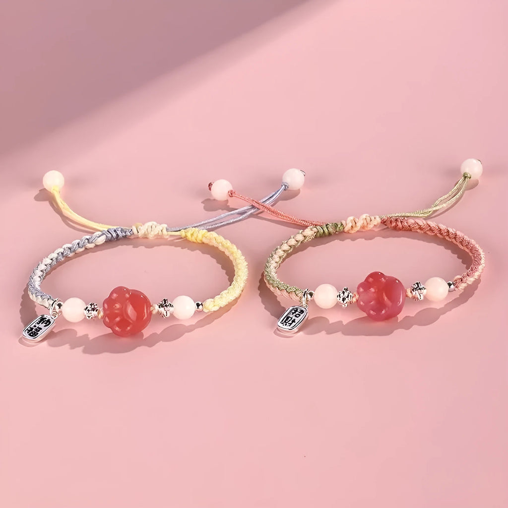 Handmade red cat's paw charm bracelet woven with pink or yellow glass beads in a pastoral couple's style.