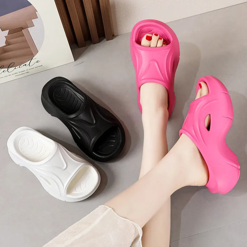 Women's thick-soled EVA slippers in white, black, or rose red colours with rounded toe design
