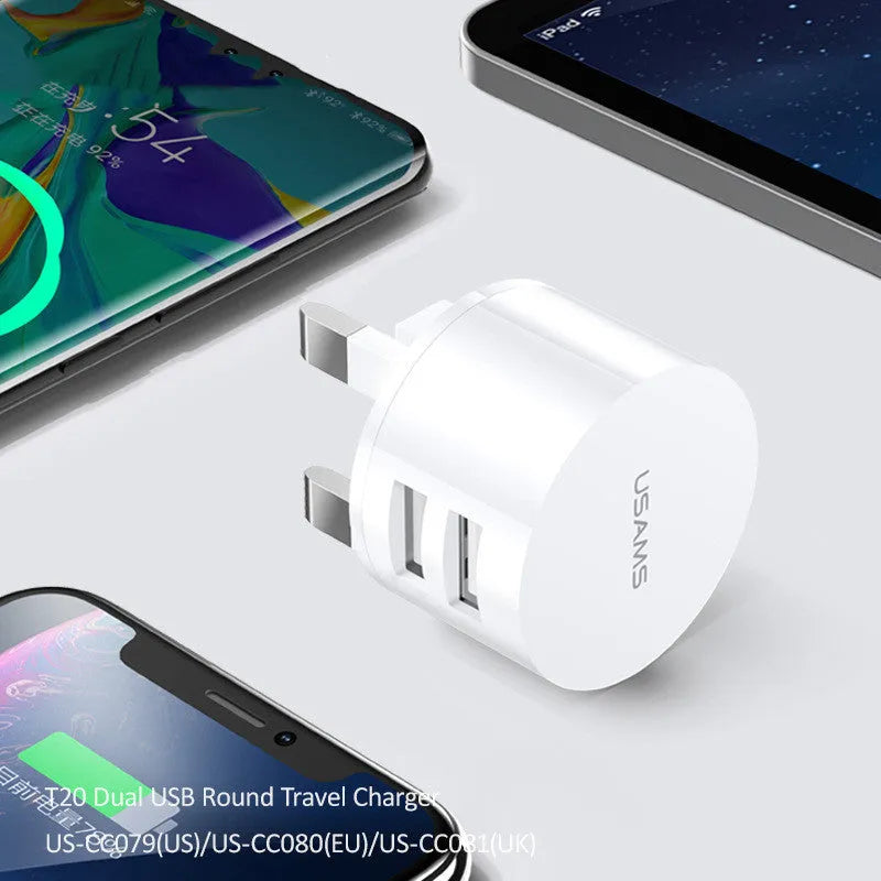 White portable universal dual USB phone charger with US, EU, and UK plug heads