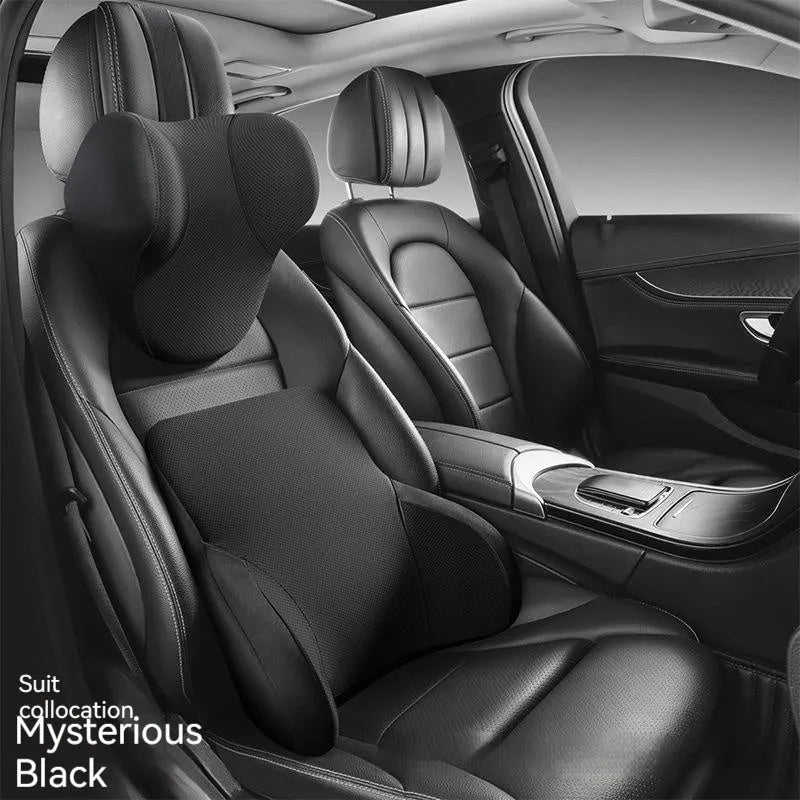 Black memory foam car headrest and lumbar support pillow set on a car seat