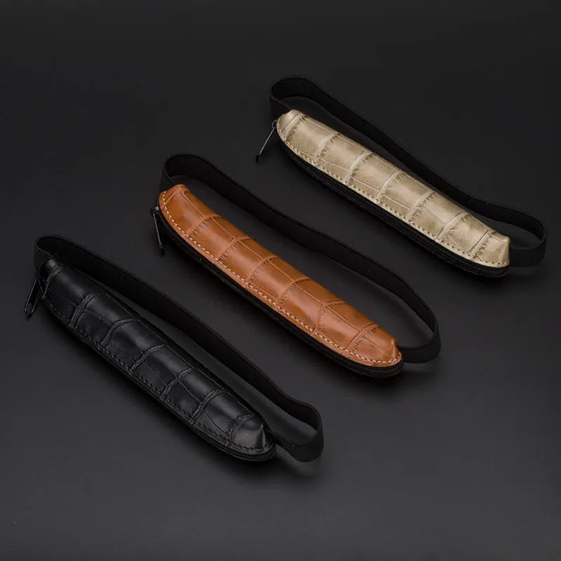 Slim 16.5cm long PU leather office pencil case in beige grey on a desk