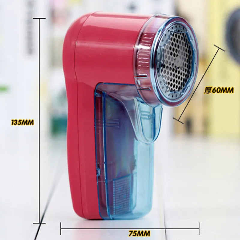 Compact white handheld electric lint remover for clothing, showing fabric shaving head.