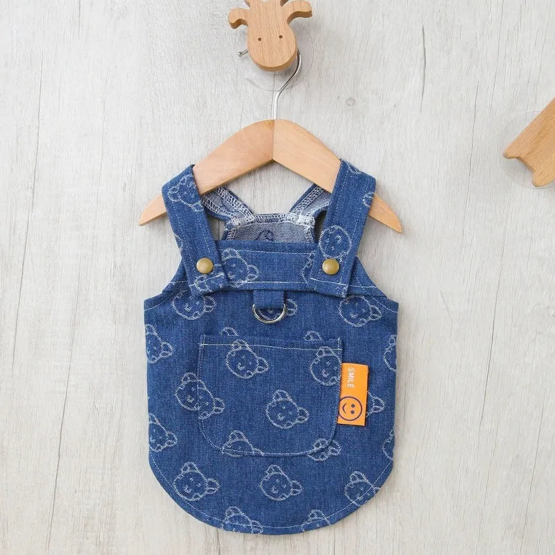 Blue denim princess dress for a small white dog, shown in brace-skirt and brace-T style variations.