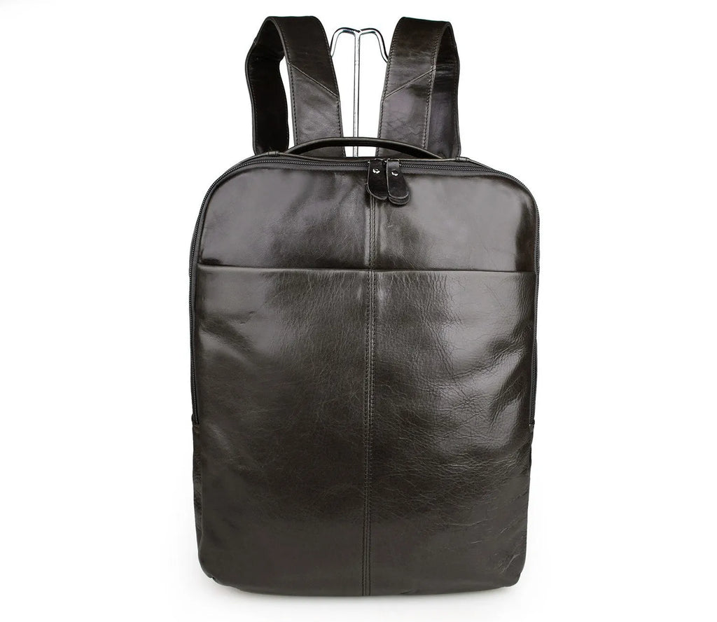 Top layer leather computer backpack in brown colour with zip closure designed to fit a 15 inch laptop