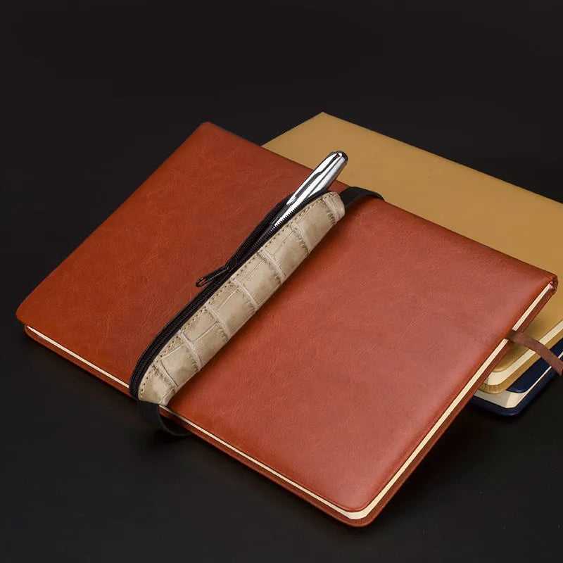 Slim 16.5cm long PU leather office pencil case in beige grey on a desk