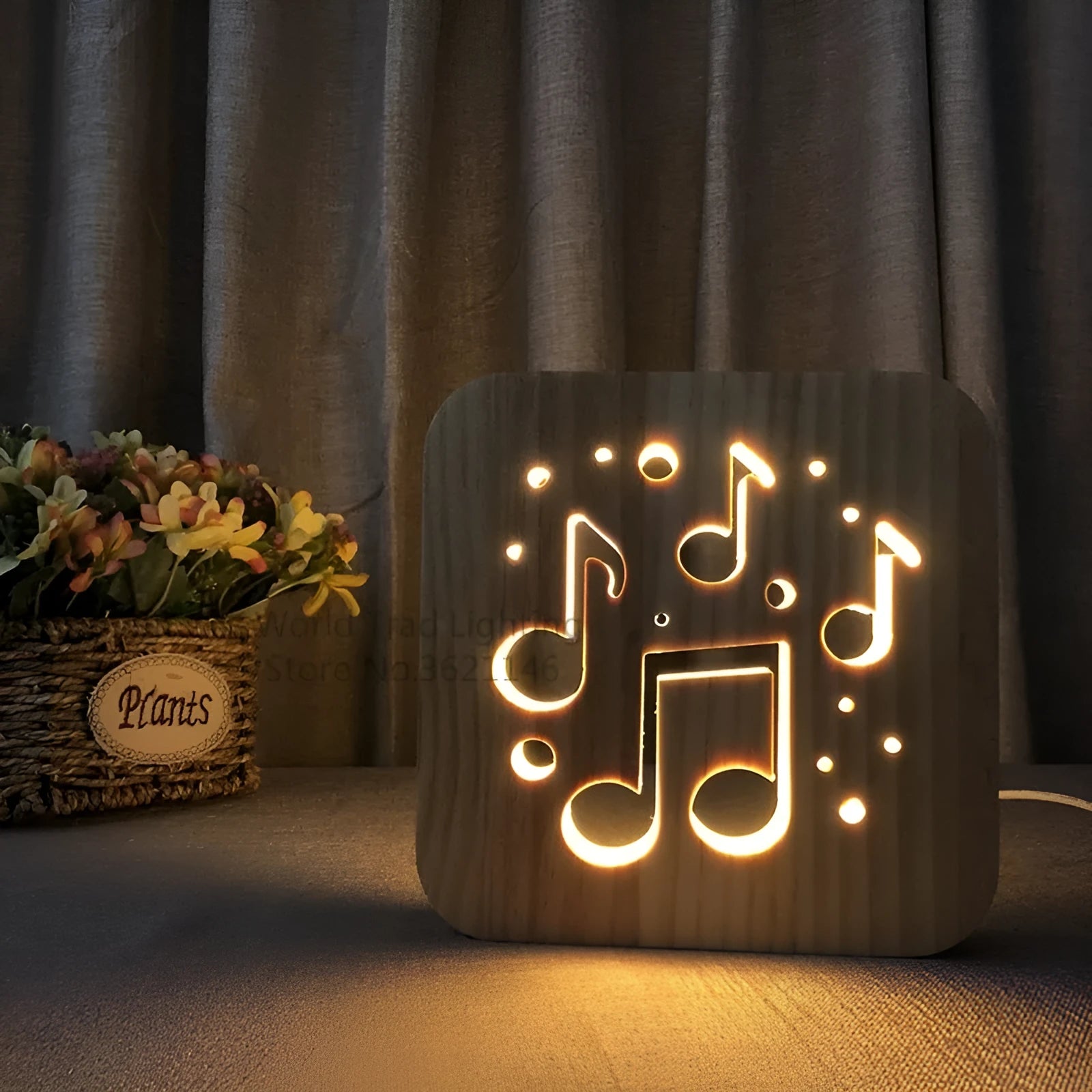 Square pine wood USB lamp with 3D design emitting warm white light on a wooden desk.