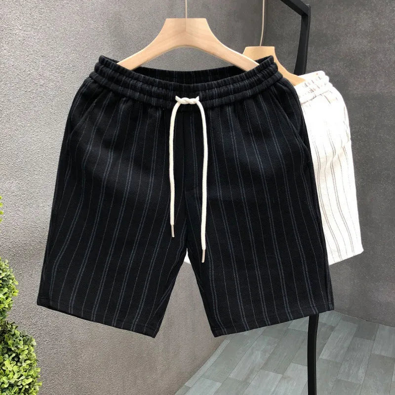 Men's black and white striped fleece-lined casual shorts with an elasticated waistband.