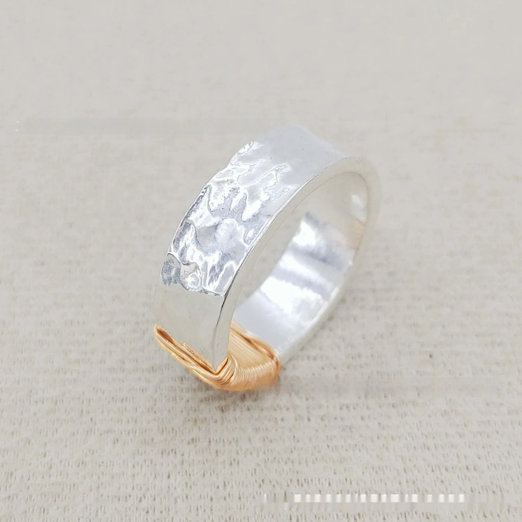 Copper geometric ring with silver golden electroplated finish and irregular vintage coil design.