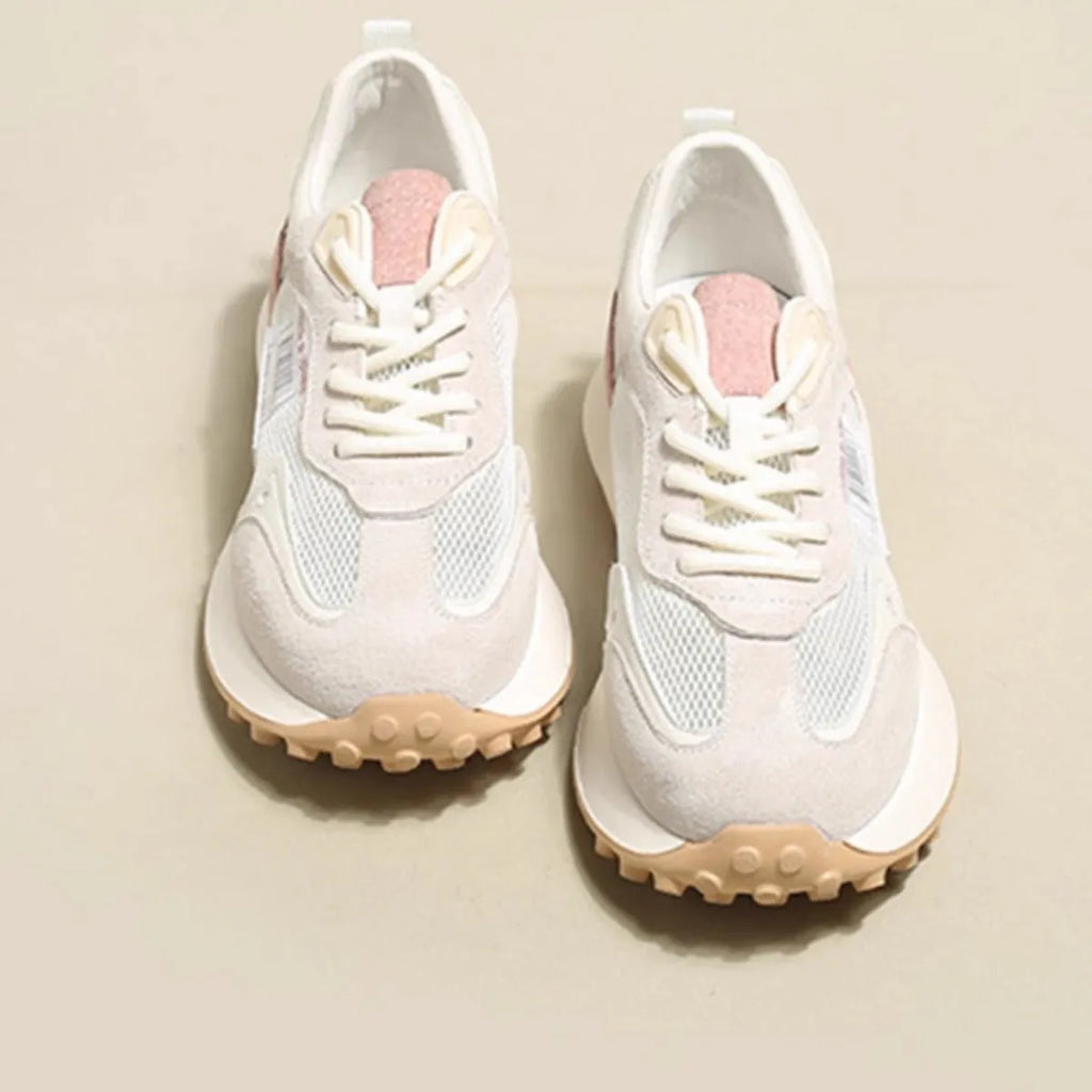 Women's grey and pink retro sneaker with low-top design and round toe