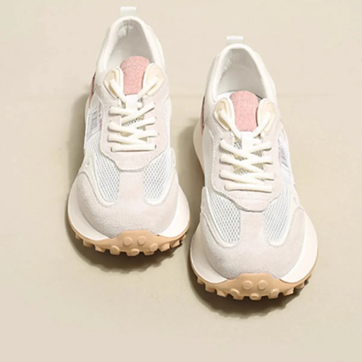 Women's grey and pink retro sneaker with low-top design and round toe