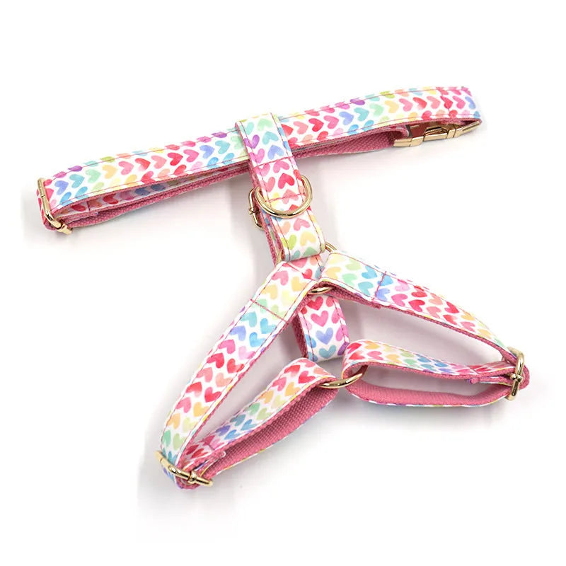 Pink dog harness with gold buckle and colourful heart-shaped crystals for small dogs