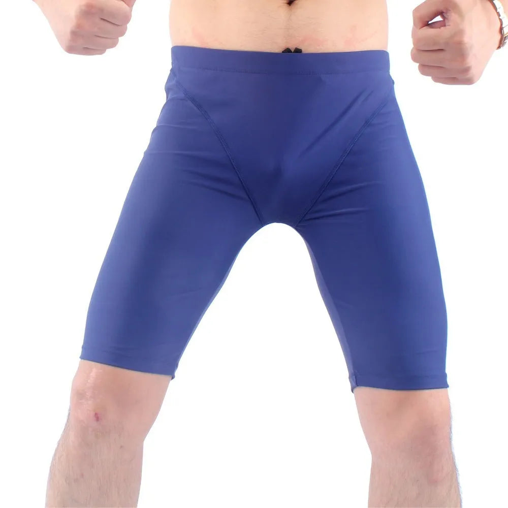 Men's green and navy blue quick-drying nylon swimming trunks with loose anti-embarrassment design