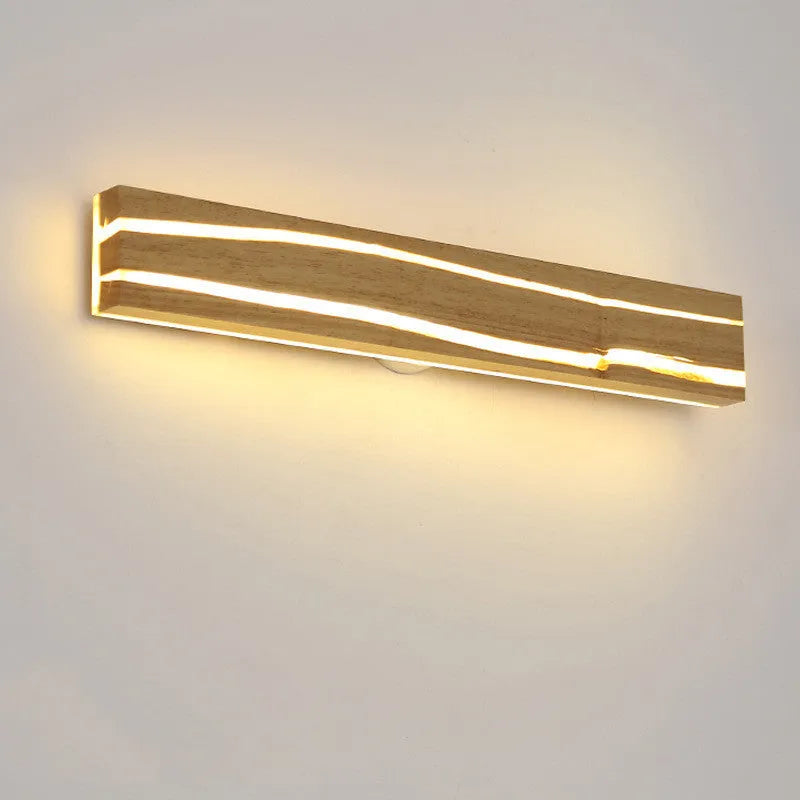Solid wood LED wall light in log colour with rubber wood frame and acrylic panel