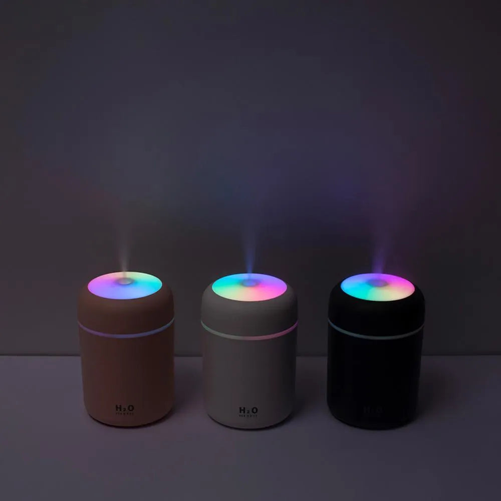 Pink USB desktop humidifier with colourful lights and water mist output