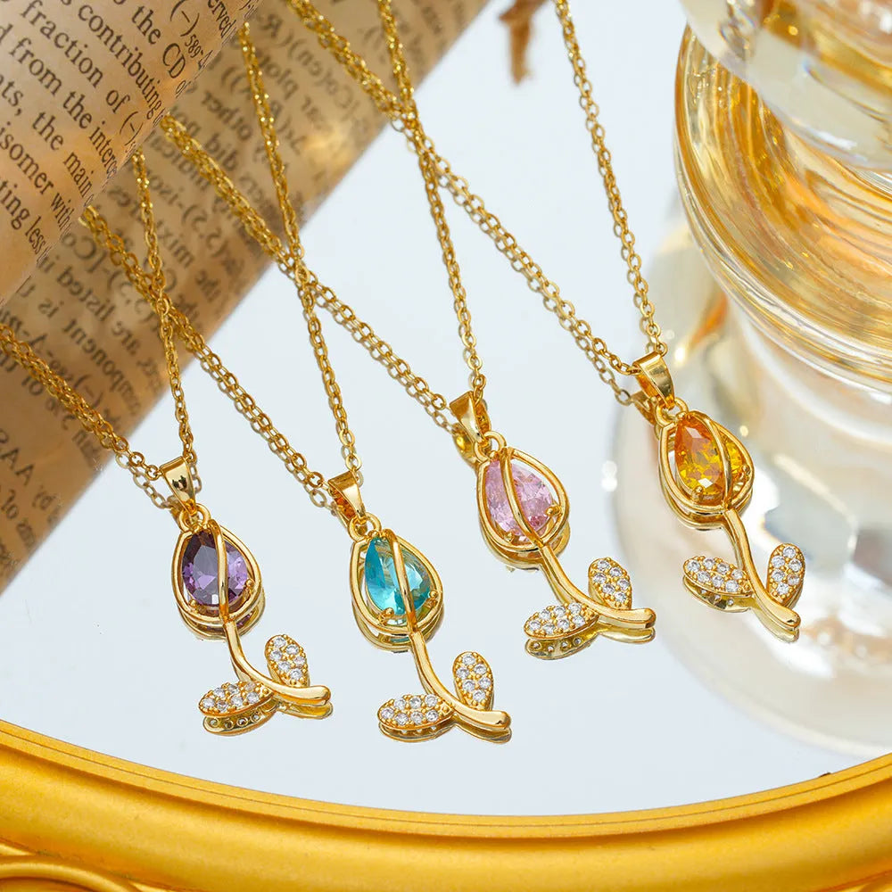 Adjustable gold tulip flower pendant necklace on an O-ring chain, showing colour options.