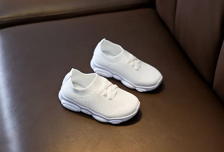 Children's lazy slip-on shoes in fabric with non-slip rubber sole, shown in available colours.