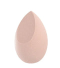 Set of seven coloured makeup sponges in different shapes on a pink background