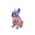 Graffiti-coloured French Bulldog resin statue on display surface
