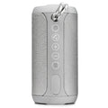 Compact flat waterproof Bluetooth speaker in black, showing its portable card-like design and control buttons.