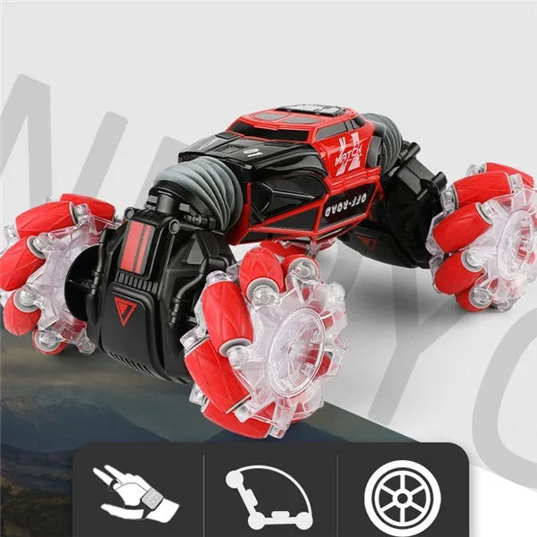 Red remote control stunt car with gesture control, morphing off-road tyres, lights, and music, measuring 32 cm long