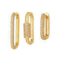Three geometric copper earrings with inlaid zircon on a square clip, in gold and white finishes.