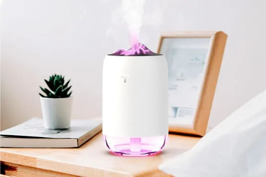 Mini cylindrical USB humidifier in turquoise green with water tank and mist outlet