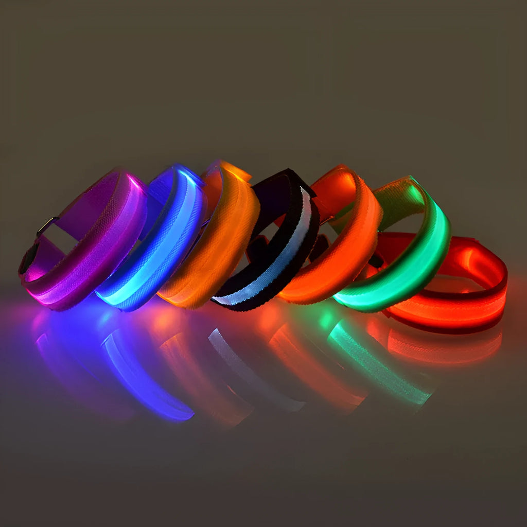 Illuminated arm band with LED lights on a black ribbon, adjustable, showing blue and red colours