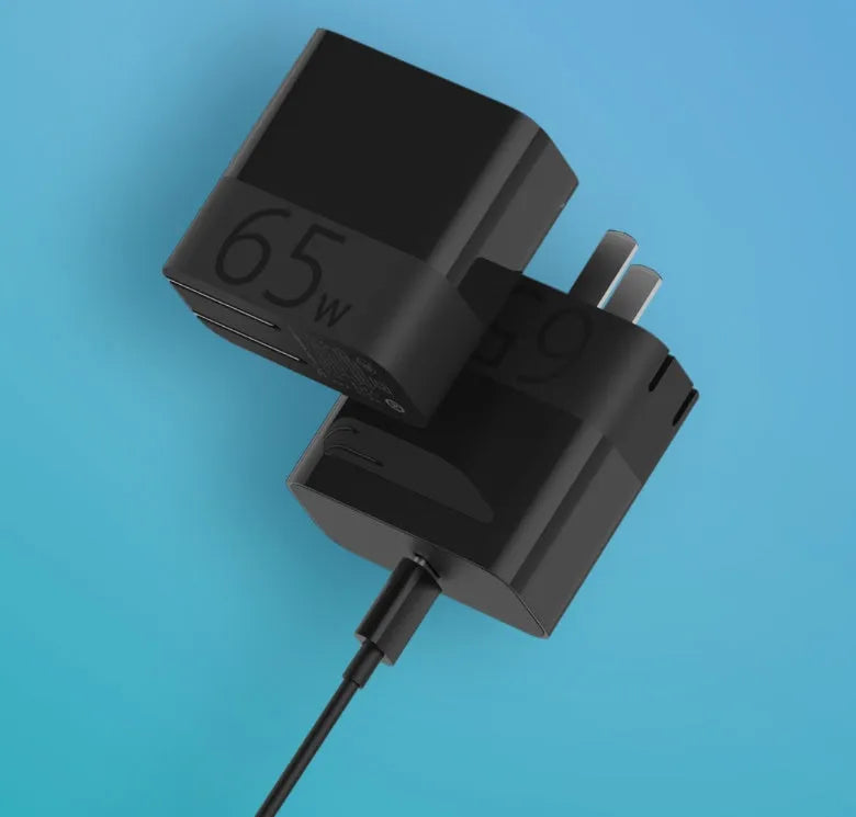 Black ZMI USB-C 65W notebook power adapter showing compact size