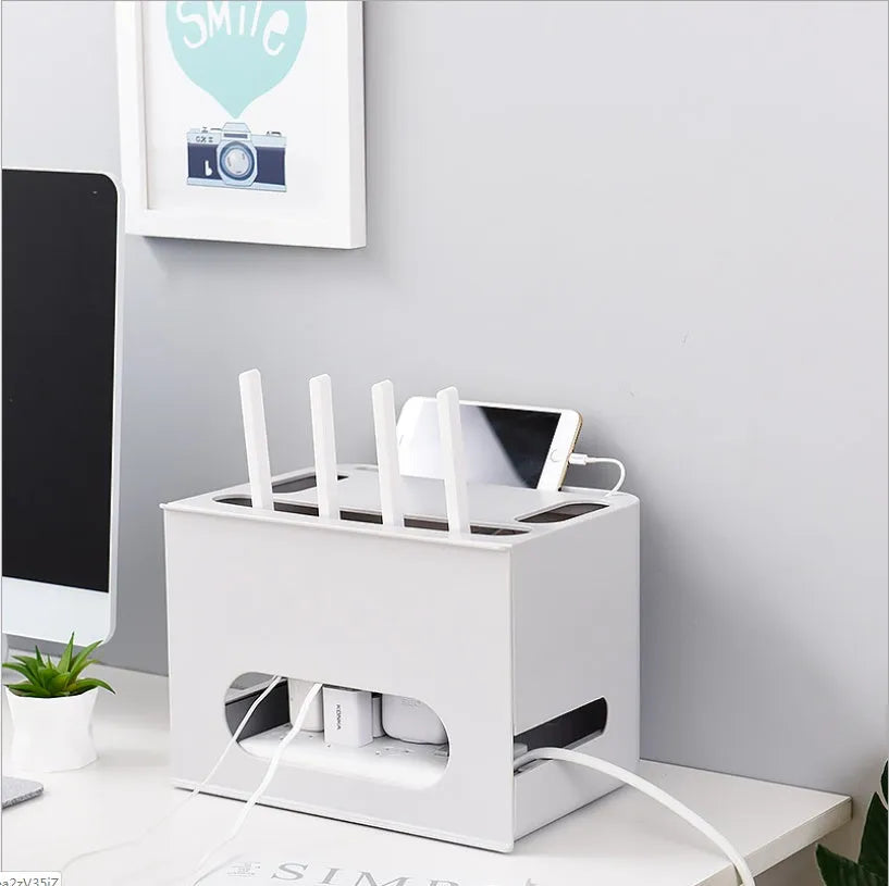 Gray and white plastic wireless router storage box with cable management compartments