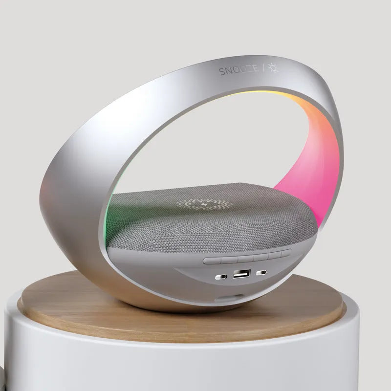 Beige or grey multifunctional Bluetooth speaker clock with wireless charging pad and digital display