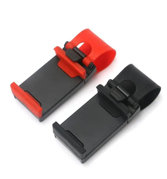 Black universal steering wheel phone clip holder with silicone pad mounted on a car steering wheel.