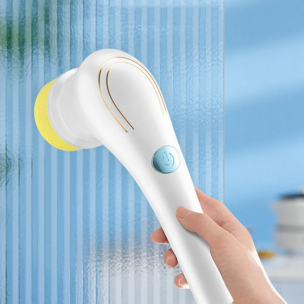White cordless electric handheld scrubber with five interchangeable brush heads and USB charging cable