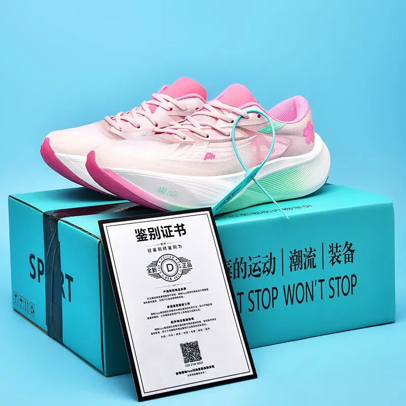 Low-top racing sneaker in glacier colour with lace-up front, carbon plate sole, and natural rubber outsole.