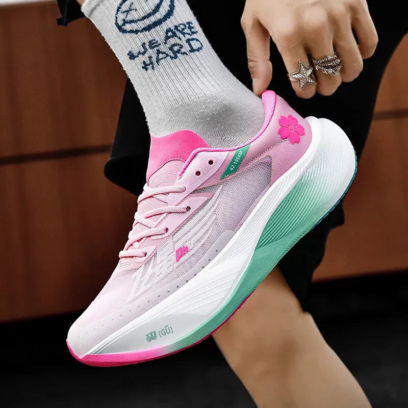 Low-top racing sneaker in glacier colour with lace-up front, carbon plate sole, and natural rubber outsole.