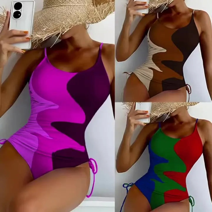 Women's blue sleeveless backless one-piece swimsuit with a striped print on a mannequin.