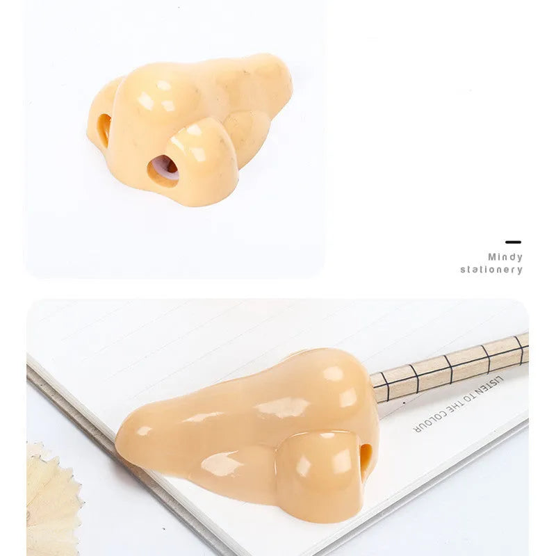 Flesh colour plastic big nostril manual pencil sharpener with geometric shape.