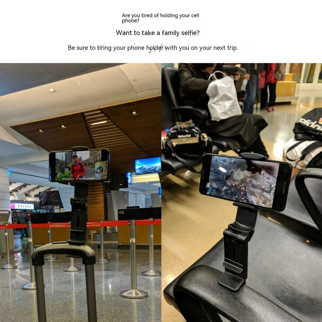 Foldable rotating universal phone holder in black on a desk next to a mobile phone.