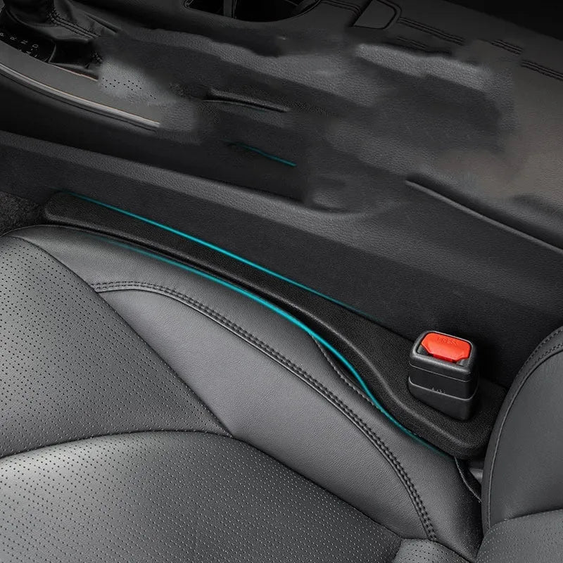Car seat gap filler strip in polyresin with handle, shown in available colour options