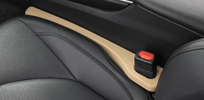 Car seat gap filler strip in polyresin with handle, shown in available colour options