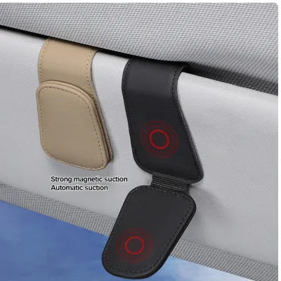 PU leather car sunglasses clip holder mounted on a grey sun visor.