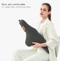 Dark grey memory foam car neck pillow resting on a car seat headrest.