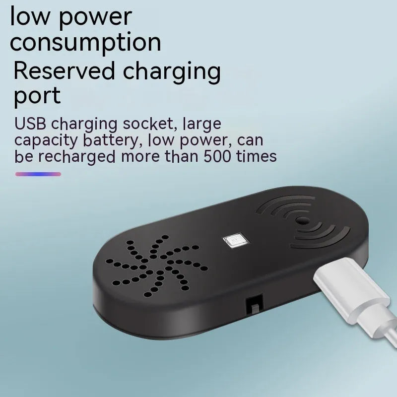 Black ABS plastic car door reminder alarm with infrared sensor and micro USB port.